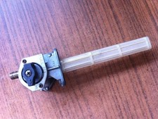 Fuel cock with strainer fuel