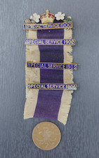 A group of four Victorian/Edwardian Primrose League 'Special Service' pin badges