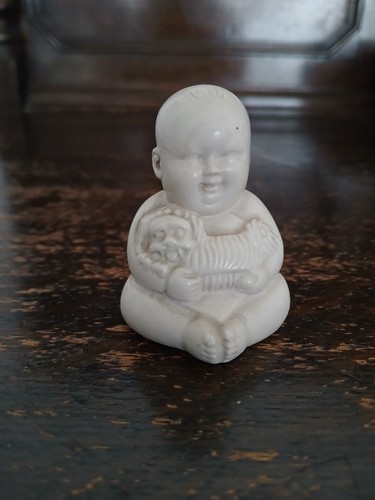 Laughing budha holding dog - budha,