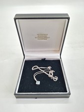 9ct White Gold Necklace with 18ct White Gold Pendant Light Blue Gemstones