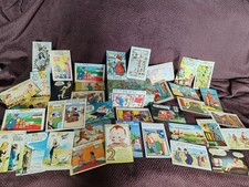 Joblot saucy vintage postcards in a tin