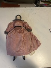 Antique porcelain doll wearing