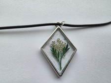 Clear Resin Pendant With White Pressed Flower
