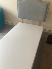 a single divan bed with underneath drawers and headboard. 