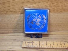 Vintage 1980s era United Nations Car Badge - blue U.N. badge with Chrome border