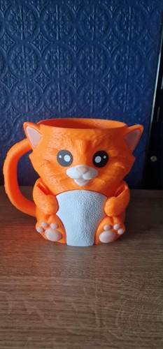 Cat icecream tub and - and, spoon