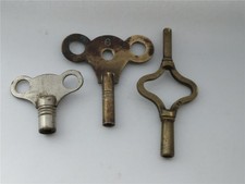 Two interesting clock keys and one wind up mechanical toy key, double ended