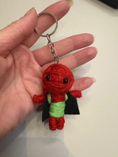 Voodoo wearing cape string