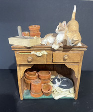 Kittens on Dresser with Plant