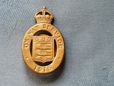 On War Service 1915 cap badge.