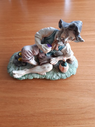 Pottery figure resting with