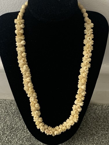 Hand carved bovine bone beaded - carved,