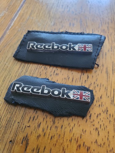 Reebok raised metal logo