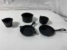 5 ANTIQUE CAST IRON SALESMAN