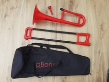 Pbone Mini red plastic trombone with mouthpiece & bag (broken zip)