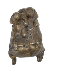 Antique bronze dogs in a
