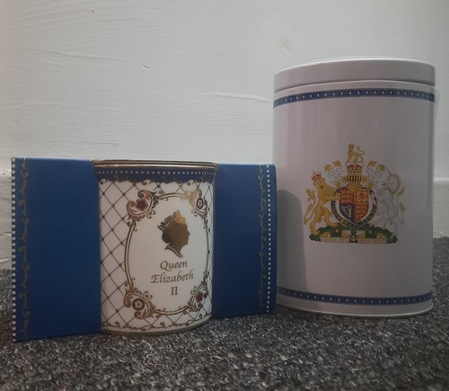 Collectable mug and tin - and,