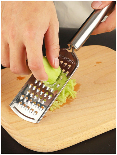 Hand held cheese grater - hand,
