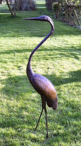 Metal black headed herons - headed,