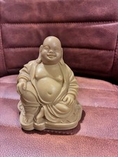Vintage smiling Buddha statue