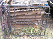 A Pair of Wrought Iron Gates and Square Posts