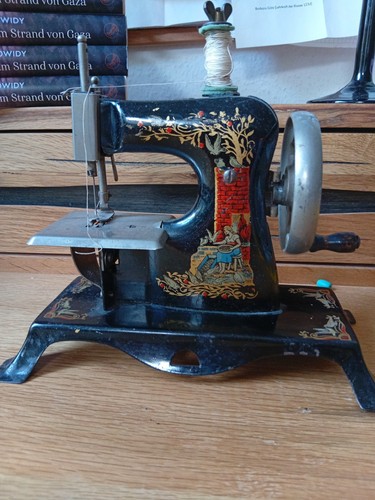 Antique casige child sewing - casige,