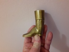 An Antique Brass Boot Match