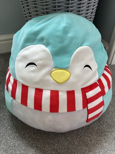 Uri the teal penguin with - teal,