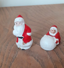 2 vintage bisque Santa  and child with snowball christmas cake decorations