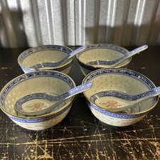 Four small Kangxi-style Chinese porcelain bowls with matching porcelain spoons.
