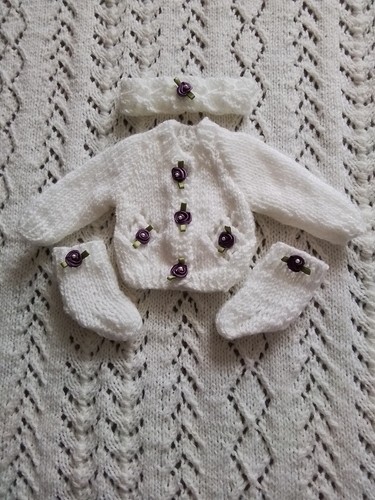 Hand knitted baby - hand,
