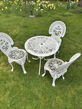 cast metal garden table and