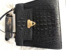 Queen Elizabeth’s platinum jubilee edition 2022 Alligator black handbag.