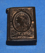 An antique vulcanite vesta