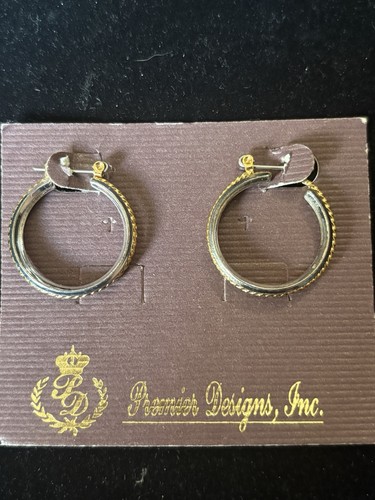 Gold and silver toned - and,