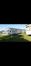  6 BERTH STATIC CARAVAN FOR HIRE SITUATED ON MARINE PK RHYL NORTH WALES.