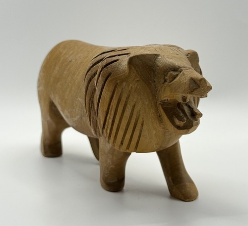 Hand carved wooden lion - hand,
