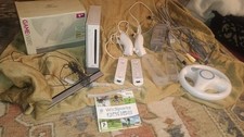 Nintendo Wii Bundle - 2 Remotes, Nunchucks ,Cables ,Wii Sports Game , Wheel,Bar