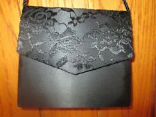 Black clutch bag with long rope handle