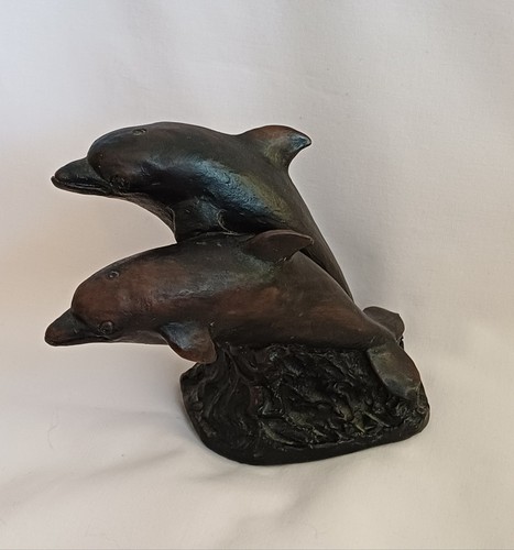 Hand carved wooden dolphin - hand,