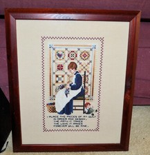 COMPLETED CROSS STITCH.  THE QUILTMAKER. FRAMED AND READY TO HANG.