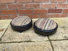 A Pair Of Antique Ebonised Foot Stools On Bun Feet