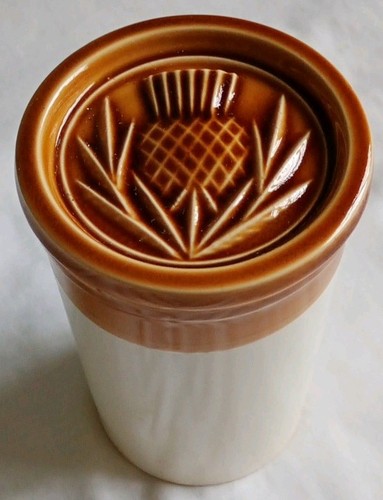 Stoneware jar with - with, thistle
