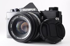 Read **NEAR MINT** Olympus