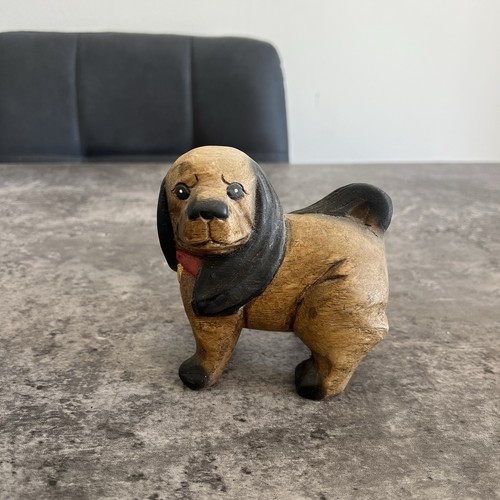 Hand carved wooden dog - hand,