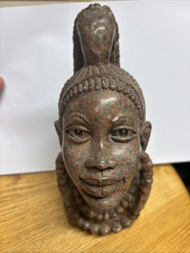 Carved stone bust resembling - stone, a