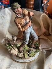 LARGE CAPODIMONTE FIGURE OF FISHERMAN STRUGGLING WITH FISH.REPIAR JOB