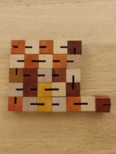 Wooden snake cube brain-teaser puzzle