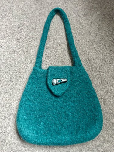 Hand knitted and felted - and,