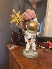 Astronaut Holding Star Rod